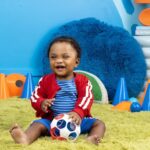 Bright Starts Oball Grippin’ Goals Rattle Soccer Ball – Red, White & Blue, Easy-Grasp Toy for Newborn and Up